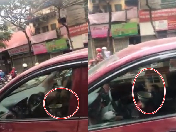 'Choáng toàn tập' với clip nữ tài xế dùng cả hai tay để ăn khi đang lái xe trên phố Hà Nội - Ảnh 1