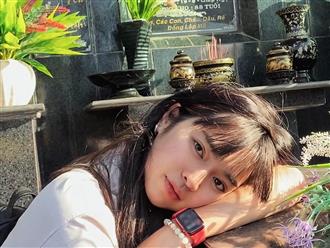 Khánh Vân ‘Mắt biếc’ gây tranh cãi khi tạo dáng bên bia mộ ông bà