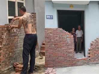 Xử phạt người đàn ông xây tường gạch chắn kín lối đi nhà hàng xóm